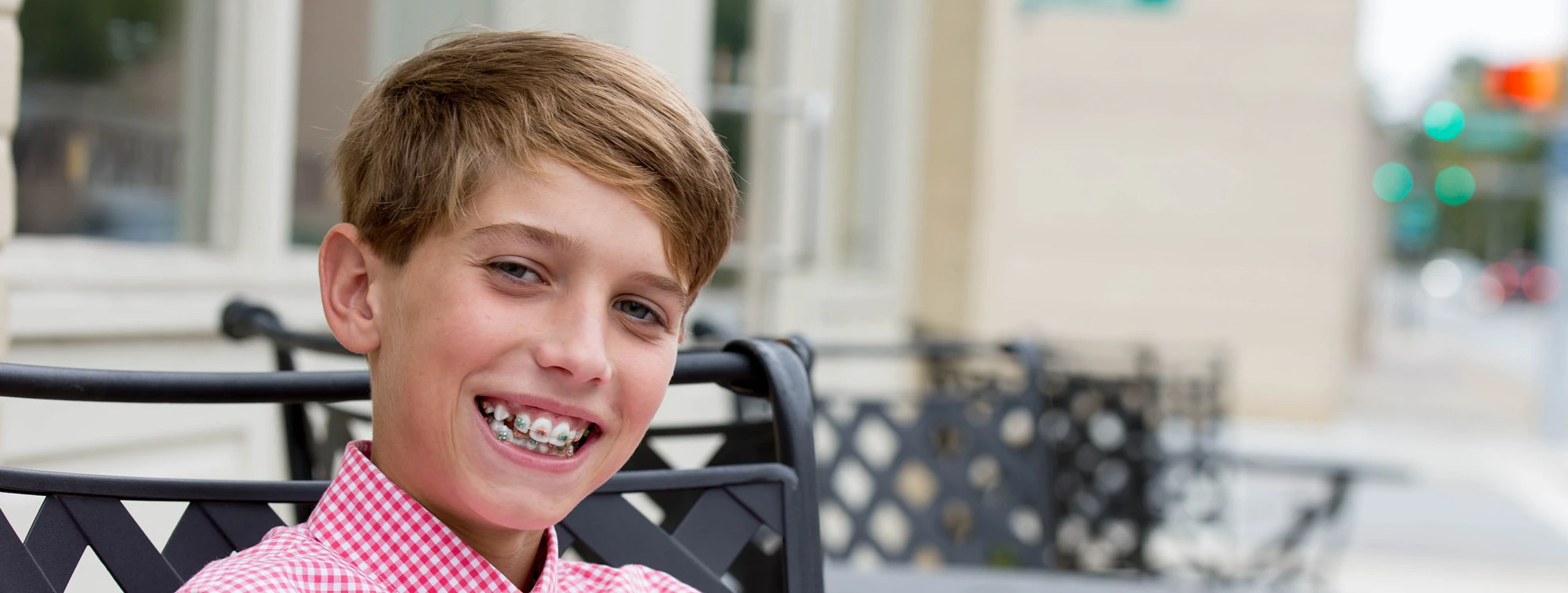 Boy In Pink Shirt Smiling