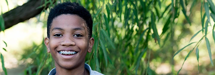 Boy Smiling Outdoors