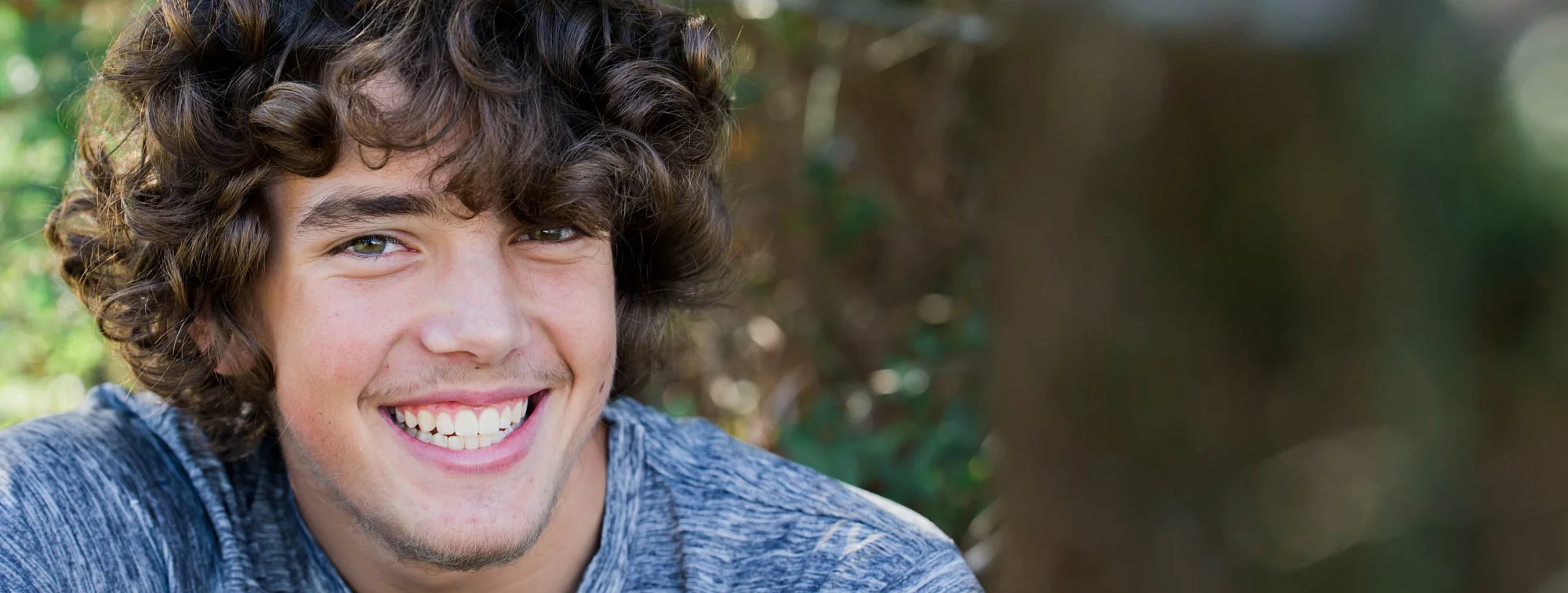 Boy Smiling Outdoors