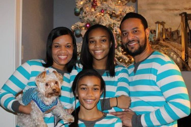 Family In Matching Pajamas With Braces